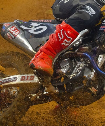 Close Up of Fox MX Boots in action on a muddy track