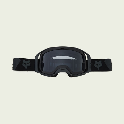 dark goggles on green background