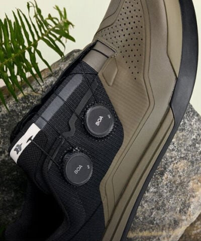 Speedframe bike helmet floating with vegetation in the back