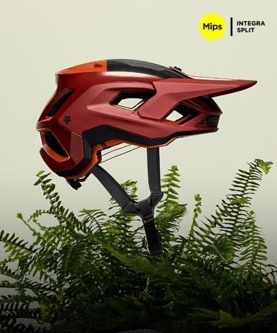 Speedframe bike helmet floating with vegetation in the back